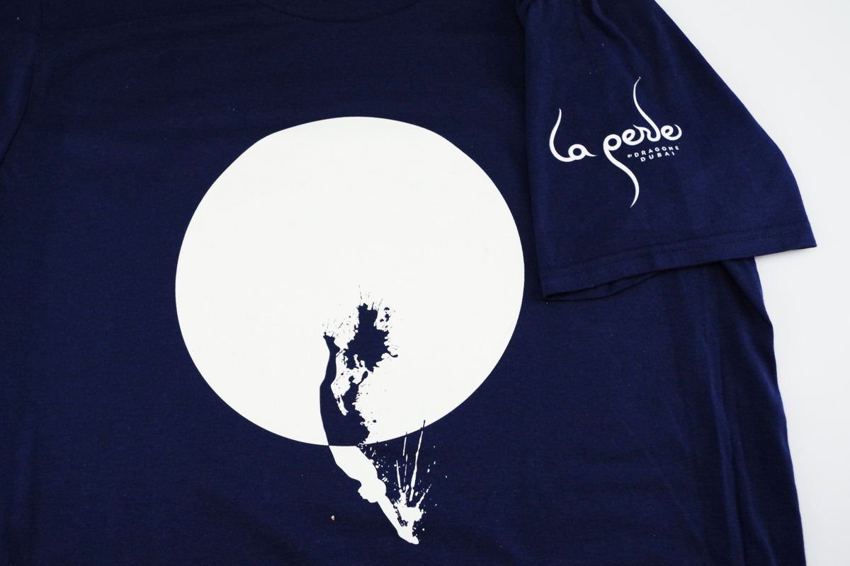 Custom navy T-shirt made for La Perle by Dragone, Dubai, with a large front print and logo on the sleeve